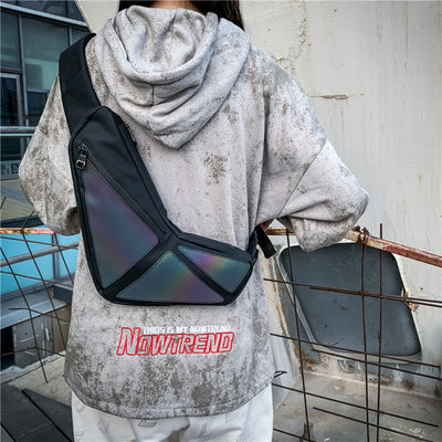 He+It+She Universal Crossbody black unisex sling bag with USB charging port worn outdoors