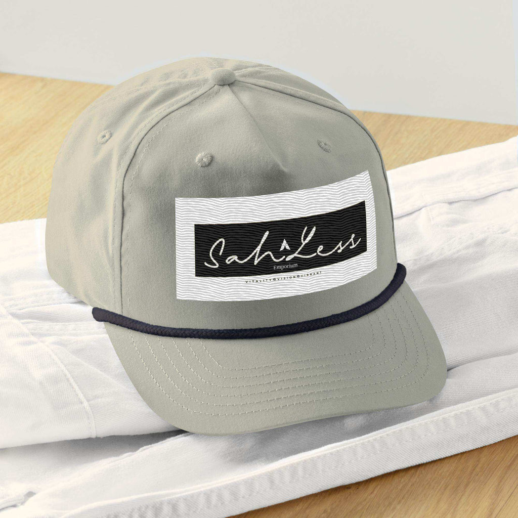 Snapback Rope Cap by SahLess Emporium with a stylish front rope detail.