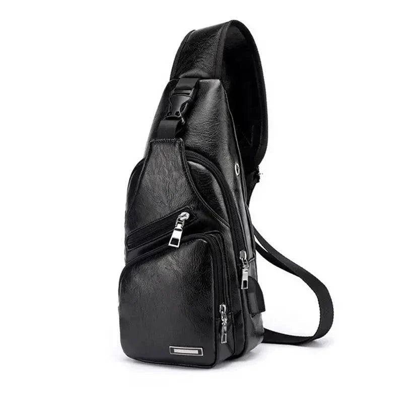 Men's travel cross body bag with USB charging, sleek black design, multiple compartments, adjustable strap.