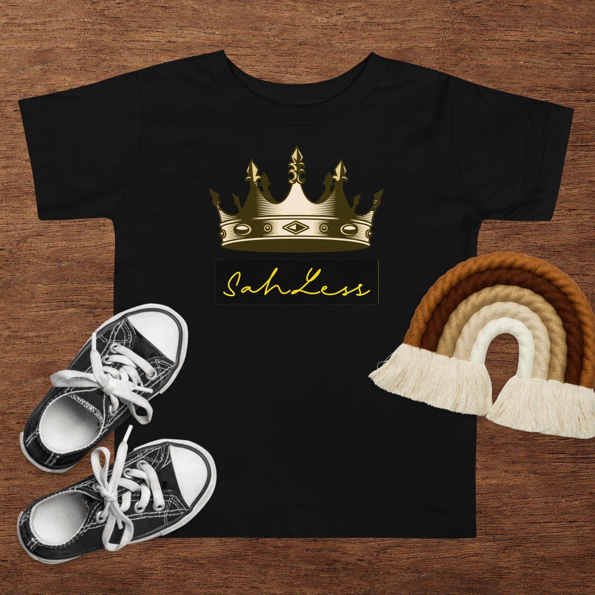 Toddler short sleeve black tee with crown design and "SahLess" text, 100% cotton.