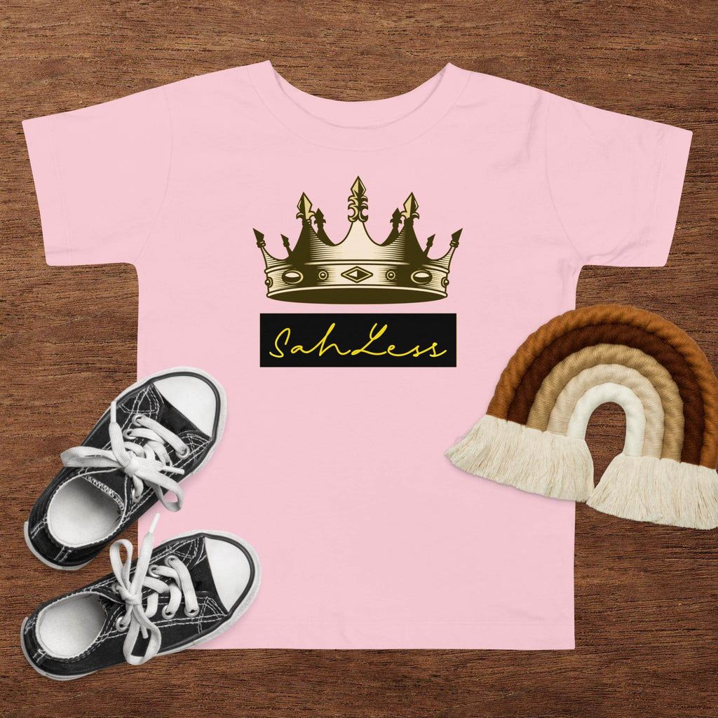 Toddler short sleeve pink tee with crown print and "SahLess" text.