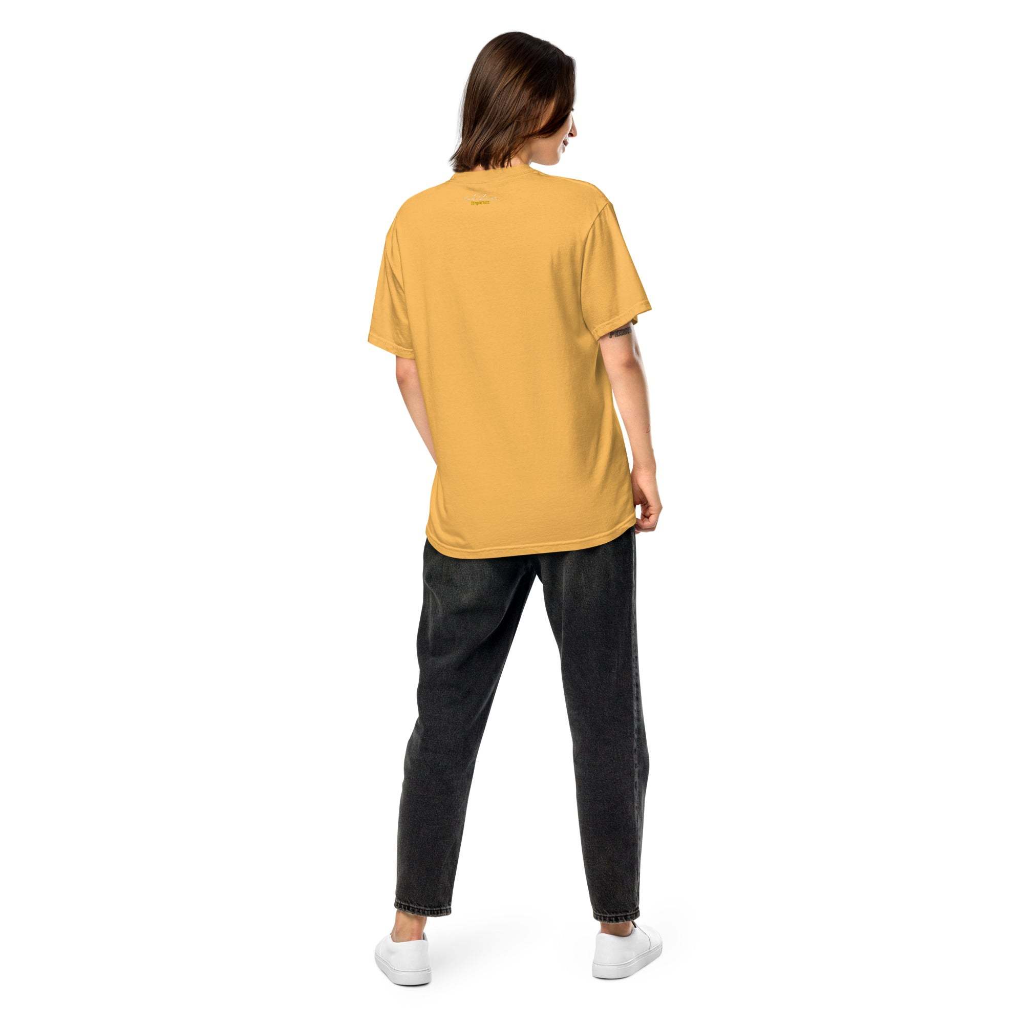 Unisex heavyweight t-shirt in mustard yellow, rear view, showcasing relaxed fit style.