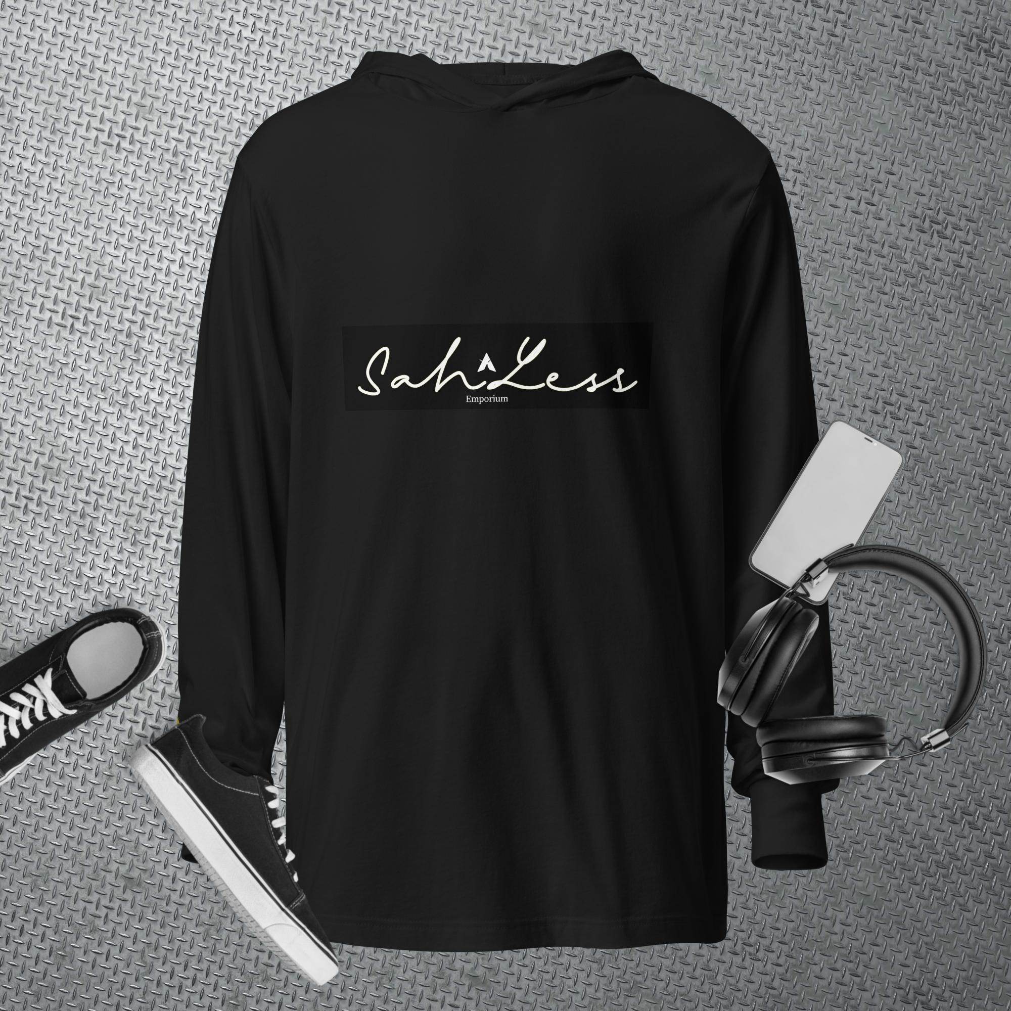 Black hooded long-sleeve tee from SahLess Emporium styled with casual sneakers and headphones, perfect for a laid-back look.