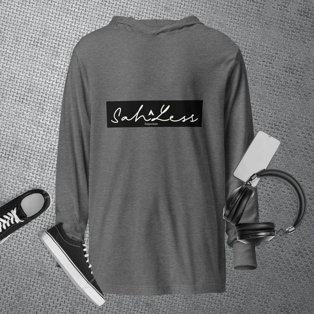 Hooded long-sleeve tee in dark gray with SahLess logo, surrounded by casual accessories.