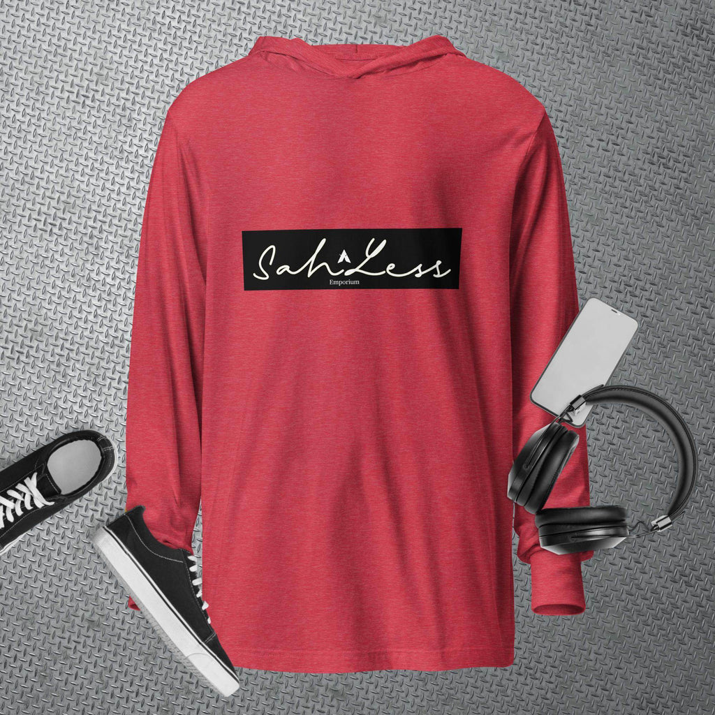 Red hooded long-sleeve tee by SahLess Emporium displayed with sneakers and headphones.