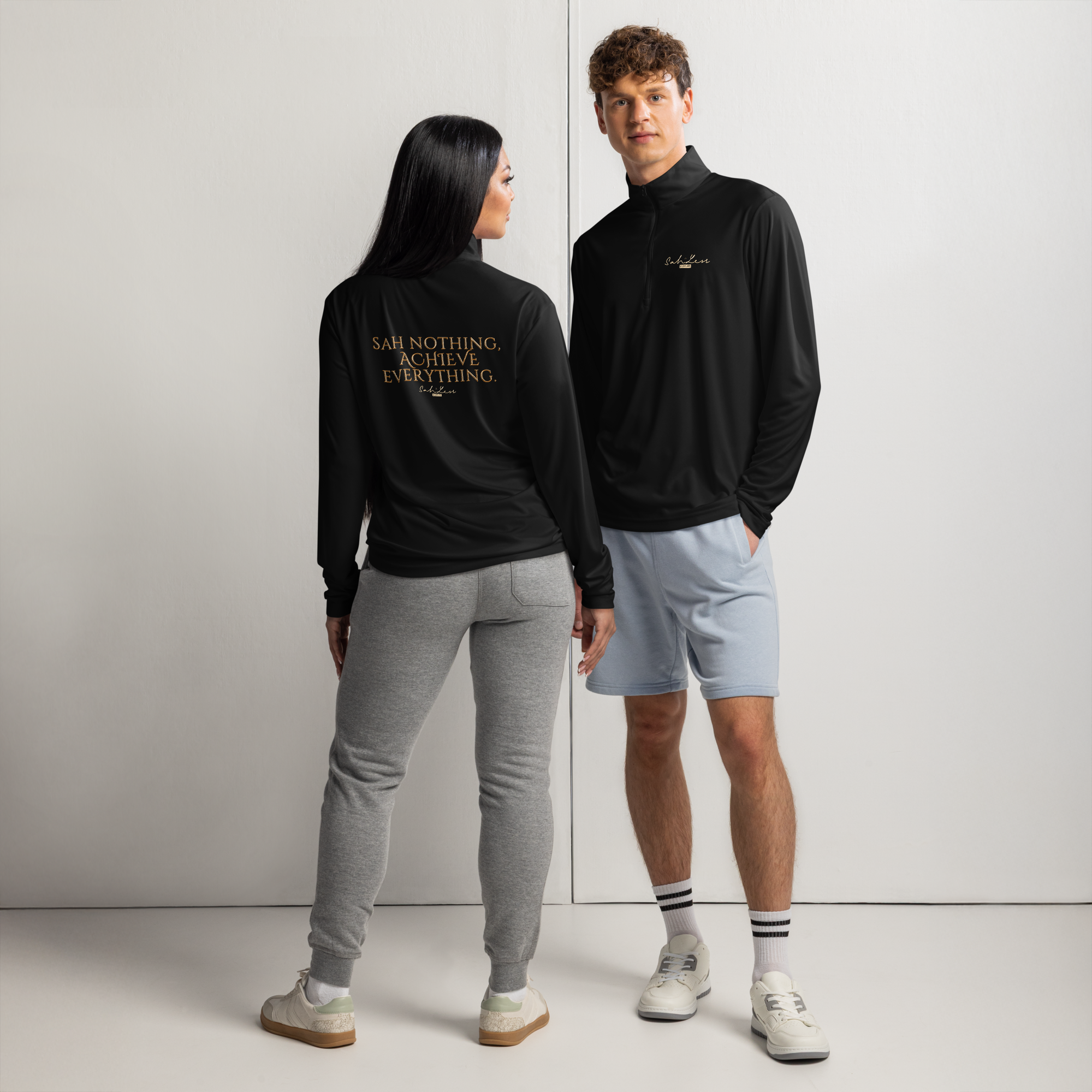 Unisex lightweight quarter-zip pullover in black with gold text, moisture-wicking and odor-resistant fabric for athletic and casual wear