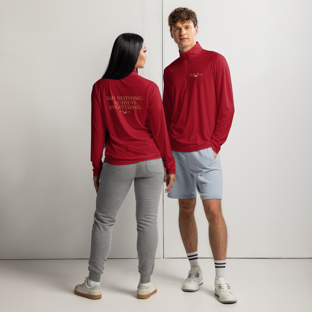 two models wearing red lightweight quarter-zip pullovers, front and back view, paired with gray joggers and light blue shorts, casual sporty look