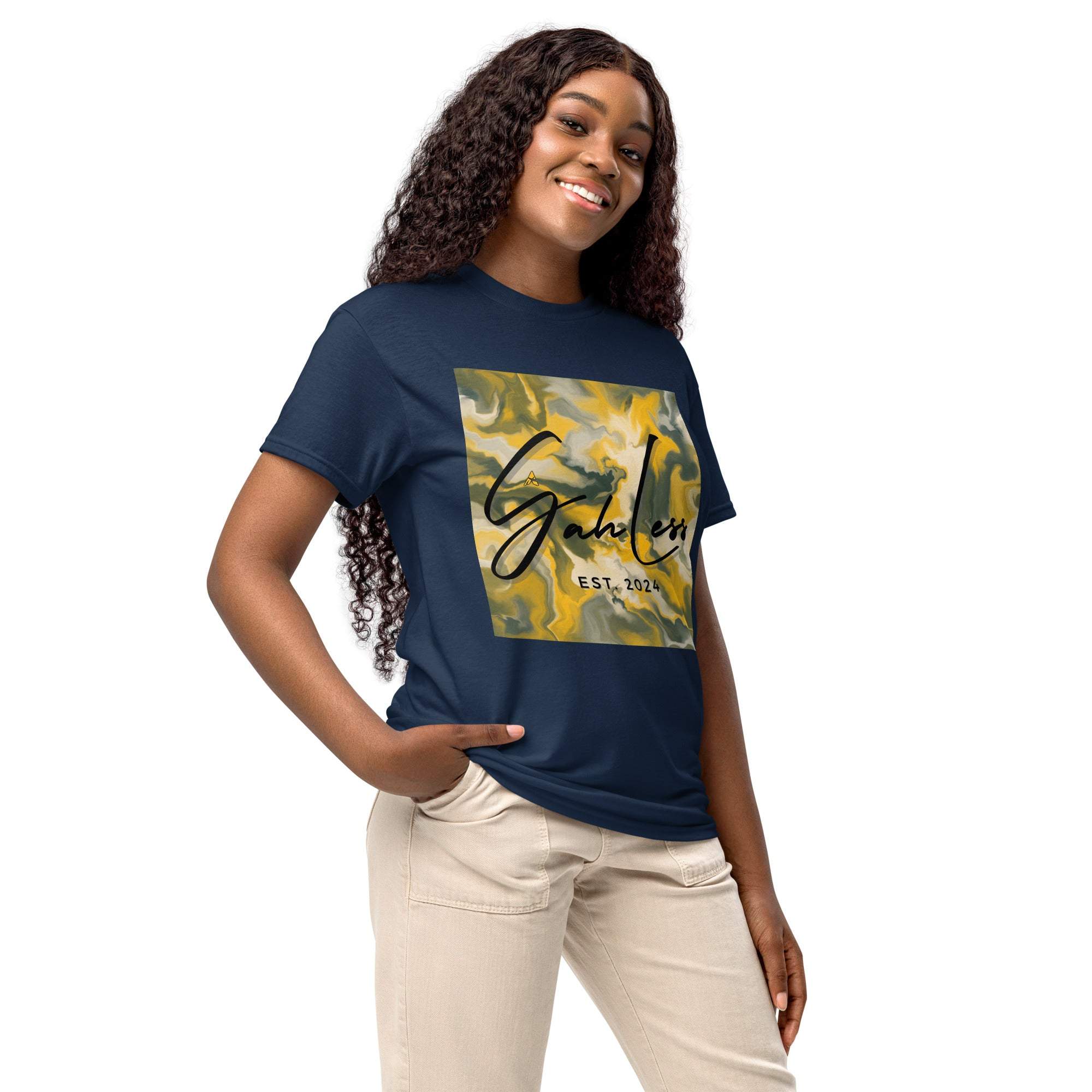 Woman wearing navy SahLess DryBlend® Performance Tee with graphic print and beige pants