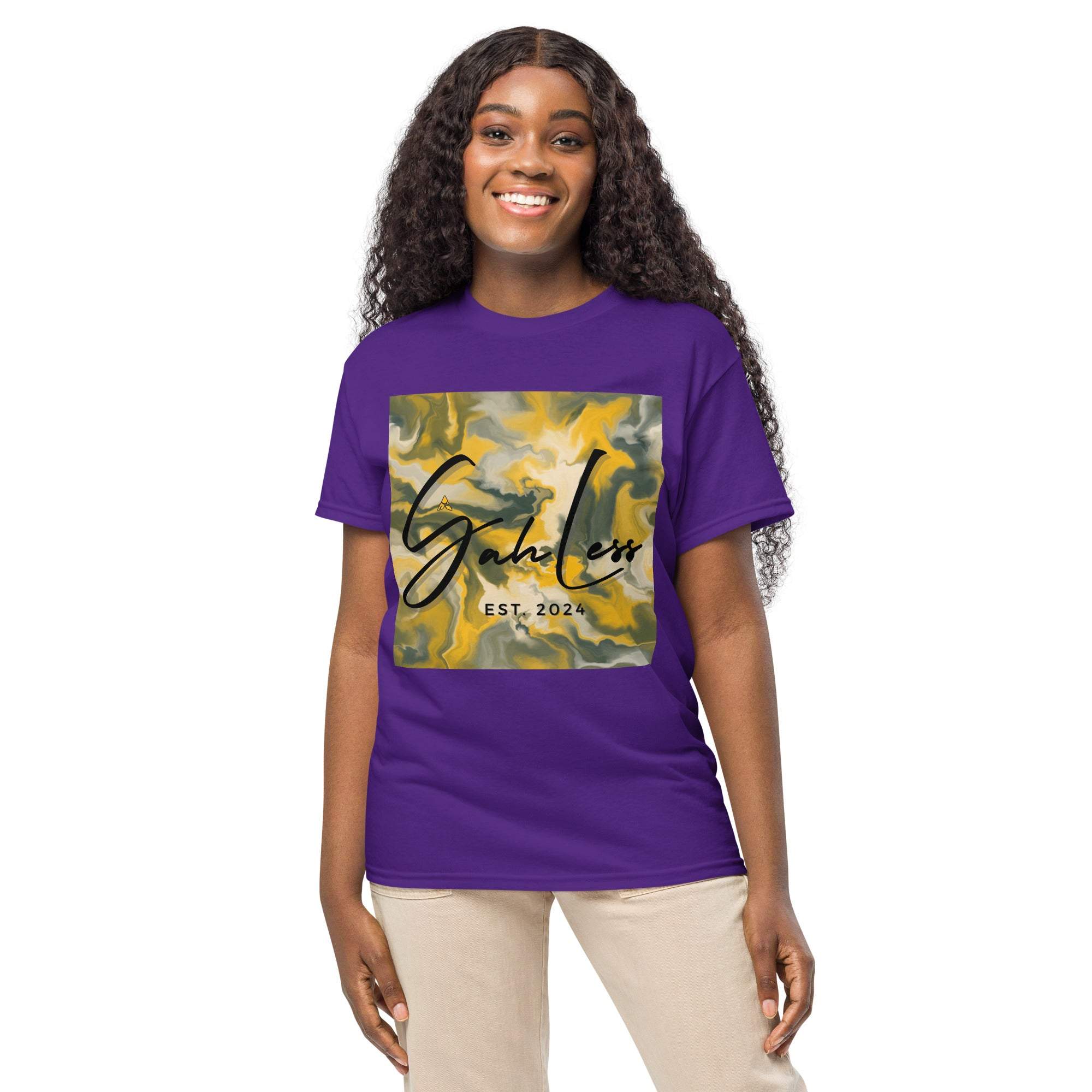 Woman wearing purple SahLess DryBlend® Performance Tee with yellow and gray graphic design and SahLess EST. 2024 text