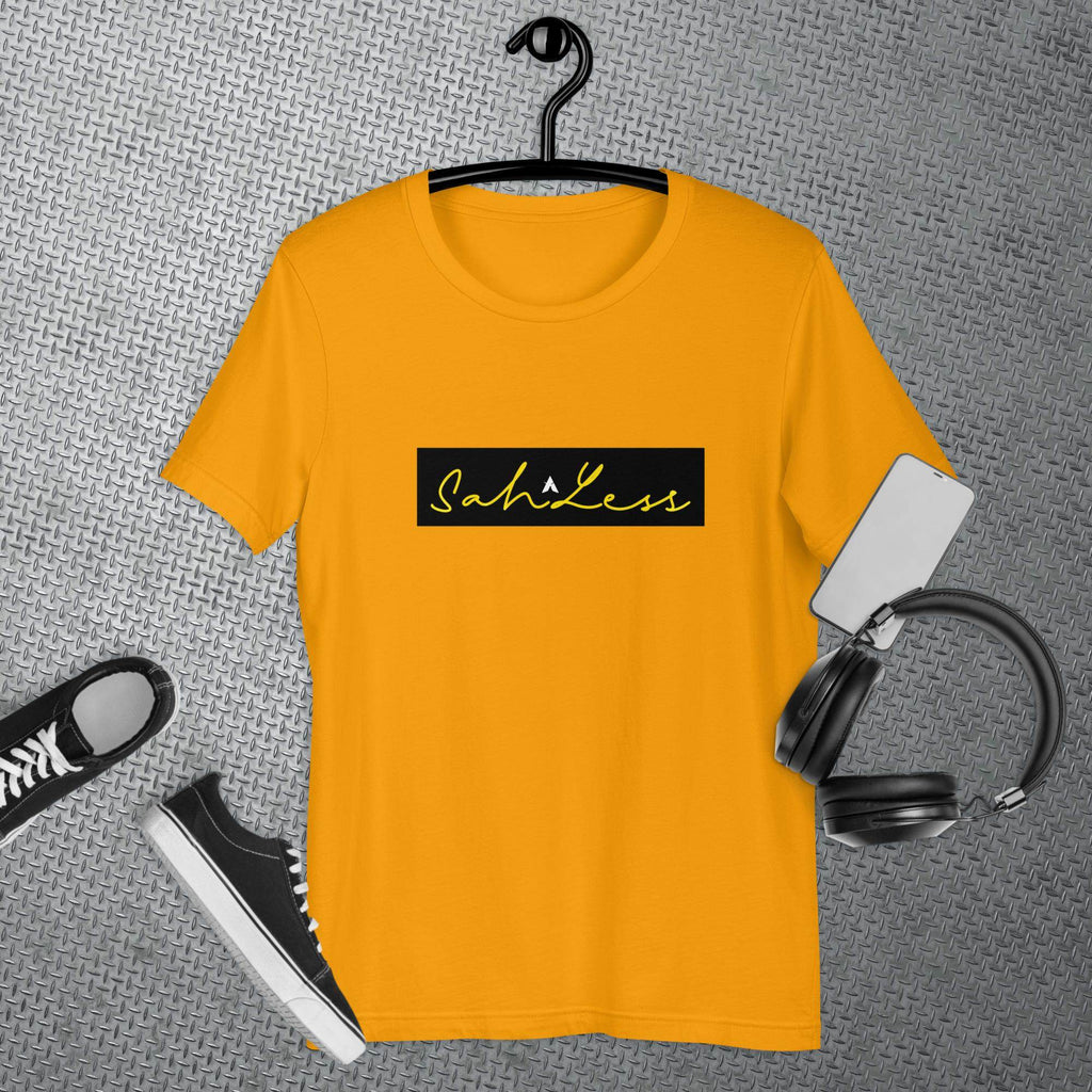 SahLess Signature Unisex T-shirt in yellow with black logo, surrounded by sneakers and headphones.