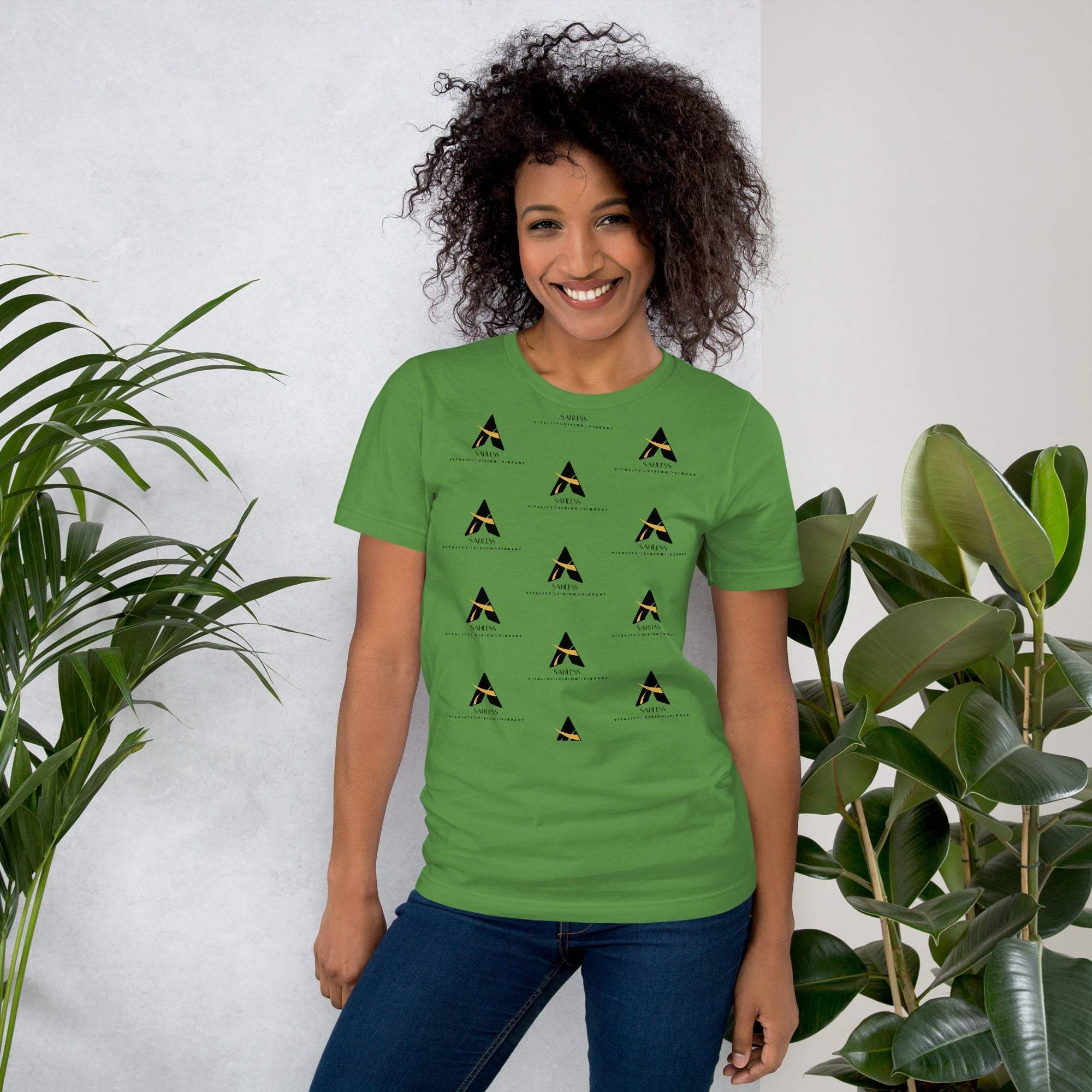 SahLess T-shirt Unisex in green, featuring graphic design, worn by model in casual setting.