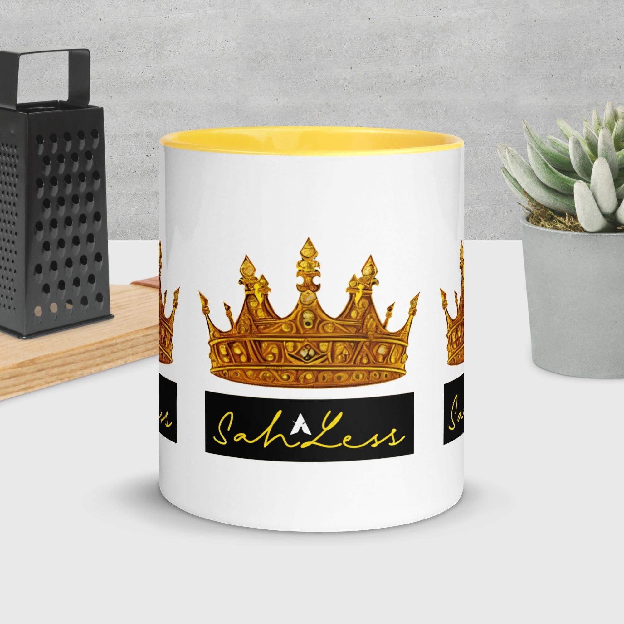 Mug with colorful rim featuring a crown design, placed on a kitchen counter.