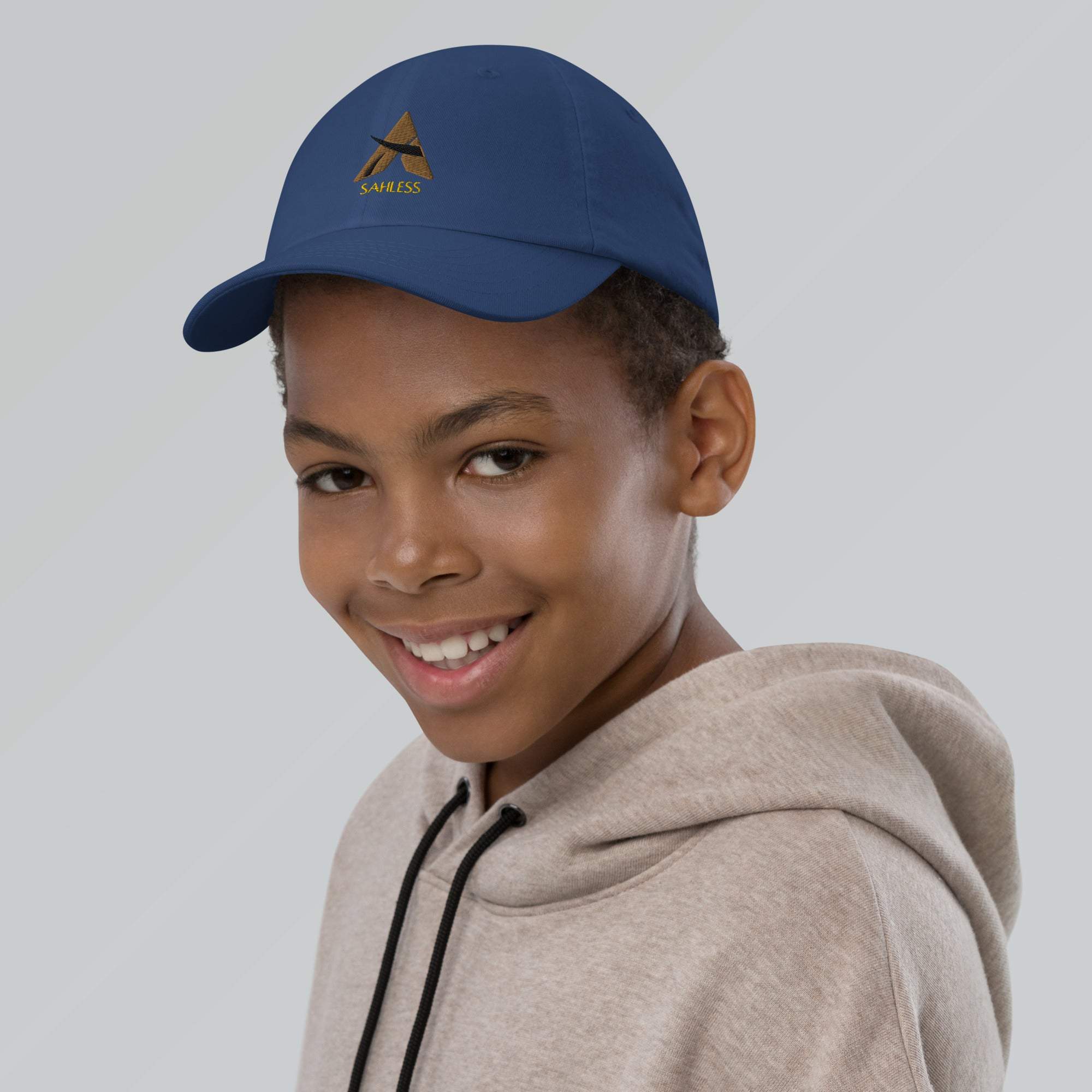 Youth baseball cap in blue with a stylish design, featuring six eyelets and an adjustable strap for a comfortable fit.