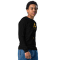 Youth wearing Sahaless long sleeve tee in black, soft cotton, with ribbed cuffs.